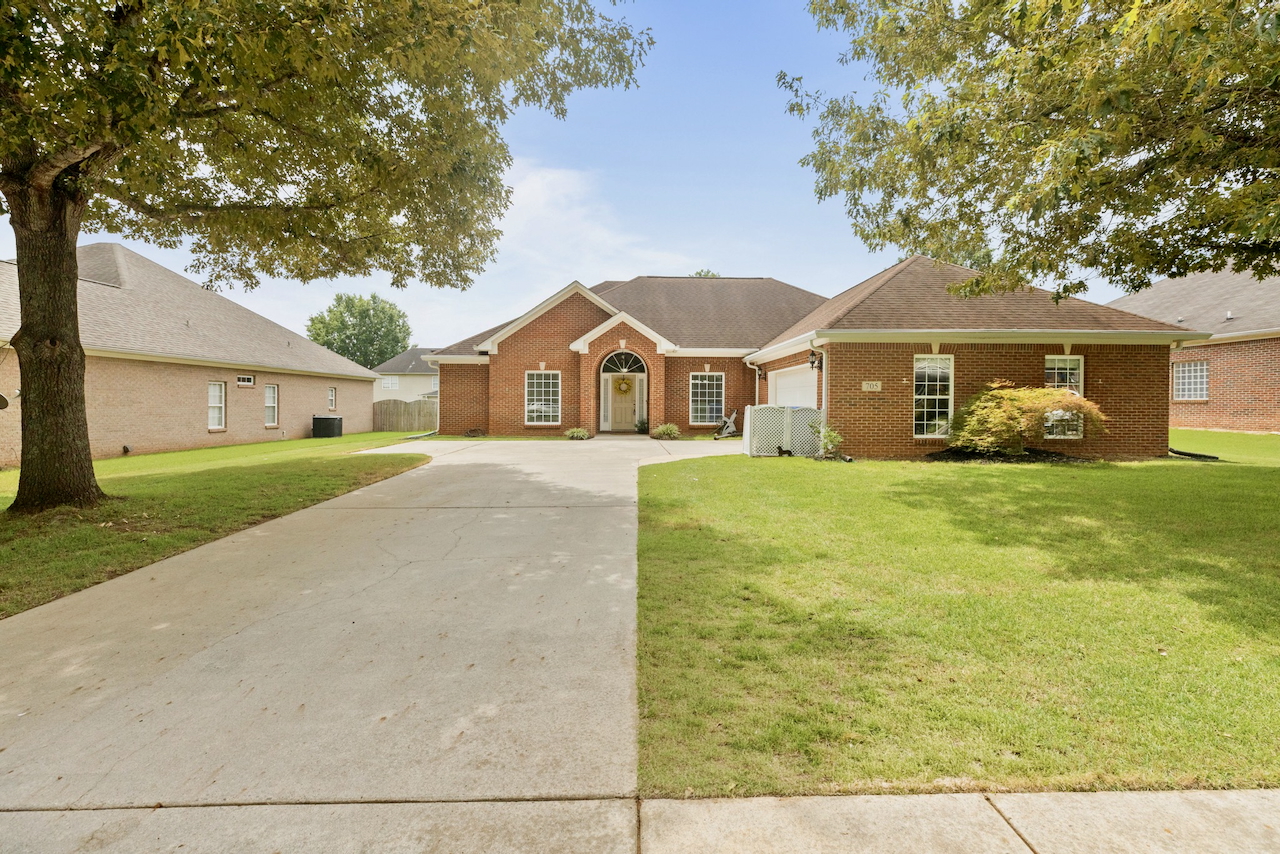 Front exterior of 705 Wade Road, a move-in ready one-level home for sale in the Creekstone community of Owens Cross Roads, Alabama.