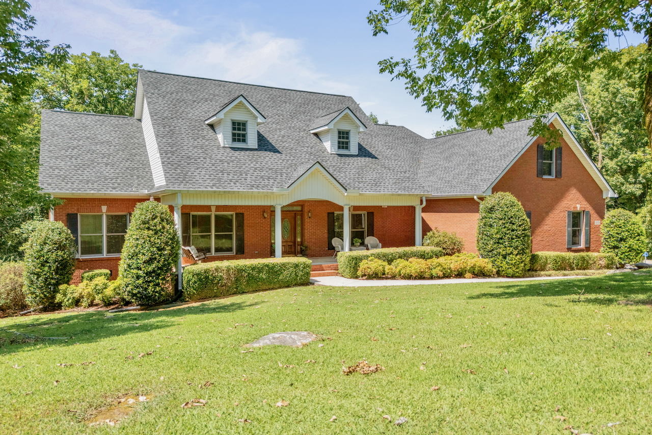 Full-brick 5-bedroom home on approximately 1 acre at 10006 Westleigh Drive in Huntsville, Alabama