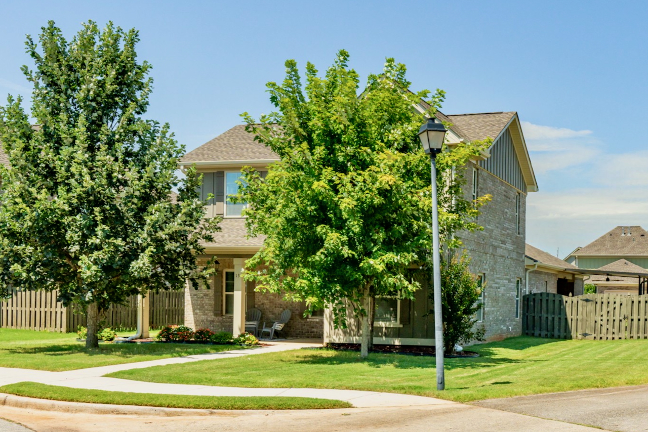 Front exterior of 13 Patana Lane, a 4-bedroom home for sale in the Lake Forest community of Huntsville, Alabama.